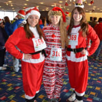 <p>Runners wore Santa Claus-themed outfits at last year&#x27;s Jingle Bell Run in Purchase.</p>