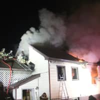 <p>Firefighters had to back out amid collapses.</p>
