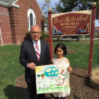 <p>Pictured are Earth Day poster contest winner Saanvi Jaswal and Mayor James Cassella.</p>
