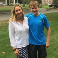 <p>Mimi Santry, left, with her son, Connor, has helped her family, which includes 5 children, about the benefits of volunteerism.</p>