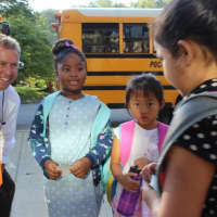 <p>Principal Adam Brown greets students on the first day of school at the Pocantico Hills Central School.</p>