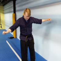 <p>Jonathan Kilburn demonstrates moves he uses when teaching special needs Taekwon-Do classes.</p>