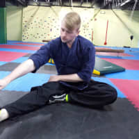 <p>Jonathan Kilburn demonstrates moves he uses when teaching special needs Taekwon-Do classes.</p>