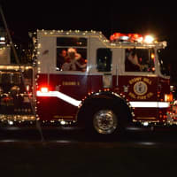 <p>Santa arrives via fire truck at the Stony Hill tree lighting in Bethel. </p>