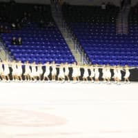 <p>Girls from Stamford compete on a Skyliners synchronized skating line.</p>
