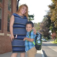 <p>After a big hug from mom, this South Street School student heads to the first day of class in Danbury. </p>