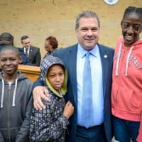 <p>Yonkers Mayor Mike Spano meets students at the Martin Luther King Jr. Academy on Wednesday.</p>