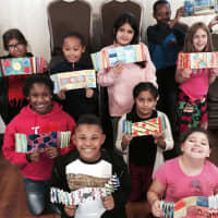 <p>Ossining Children&#x27;s Center youths display their interpretation of the work by Yaacov Agam, one of the artists whose work will be on display as part of this year&#x27;s Festive Stroll of Homes. </p>