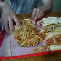 <p>Super Duper Weenie in Fairfield piles the fries high along with homemade condiments on its famous franks.</p>