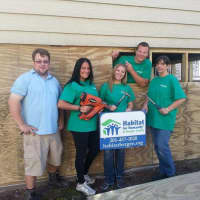 <p>Sussex Bank employees rebuild homes destroyed by Superstorm Sandy in Little Ferry.</p>
