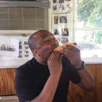 <p>Munching on a &quot;top dog&quot; at The Original Swanky Franks in Norwalk.</p>