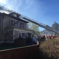 <p>Firefighters tackle the blaze at 175 White Plains Road, the home of the Blessed Lamb Preschool and Blessed Assurance Prayer Community, in Trumbull.</p>