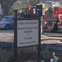 <p>Firefighters tackle the blaze at 175 White Plains Road, the home of the Blessed Lamb Preschool and Blessed Assurance Prayer Community, in Trumbull.</p>