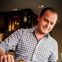 <p>Owner Walter Cappelli making a Negroni at Table 104 in Stamford. </p>