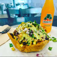 <p>Guac Time&#x27;s Taco Salad Bowl served with a Mexican soda.</p>