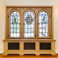 <p>The home&#x27;s stained glass windows were designed by renowned artist, Owen Bonawit.</p>