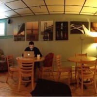 <p>A customer enjoys a cup of coffee at The Crafted Kup in Poughkeepsie.</p>