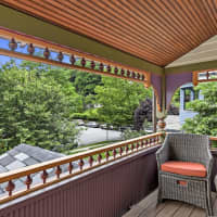 <p>The second-level porch is one of the aspects that define this type of home.</p>