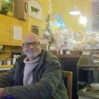 <p>Kevin &quot;Poppy&quot; Roberts, 73, at his favorite writing (and watering) hole: Black Cow cafe in the heart of Pleasantville.</p>