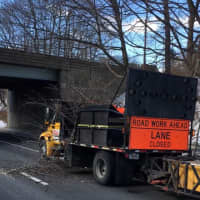 <p>High winds sent a tree branch crashing down on contractors workers on I-95 in Greenwich on Monday.</p>