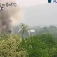 <p>Smoke from the truck fire visible a mile away.</p>