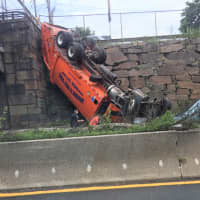 <p>The truck went through a fence and off the overpass (top left).</p>