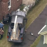 <p>The truck, which was hauling a new door, struck a brick multi-family house.</p>