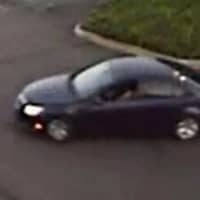 <p>Surveillance footage of the car that the credit card theft suspects are believed to be driving</p>