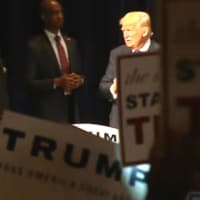<p>Donald Trump is surrounded by a sea of campaign signs — handed out by the campaign — at the end of his speech in Bridgeport.</p>