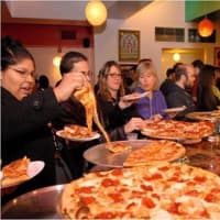 <p>The melted cheese was flowing at Two Boots, a Bridgeport food and music venue, which served Cajun as well as Italian food.</p>