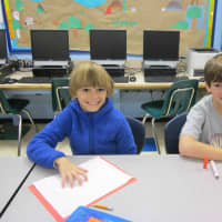<p>Fourth-graders at the Carrie E. Tompkins Elementary School write letters of thanks to servicemen and women.</p>