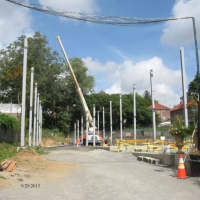 <p>Construction crews in Mount Vernon installing steel beams around the tennis courts at Memorial Field. </p>