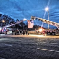 <p>Monday night, members of the West Harrison and White Plains fire departments flew the American flag over Interstate-287 in tribute to Tech. Sgt. Joseph Lemm as an NYPD-led motorcade proceeded through Westchester County.</p>