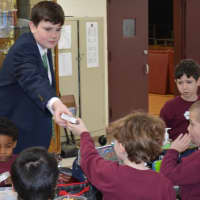 <p>8th Grader Connor Breen of Scarsdale handed out ice cream treats as part of his duties while taking part in “Principal for a Day” at Iona Prep.</p>
