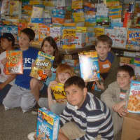 <p>Local students help collect cereal for those in need.</p>