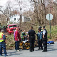 <p>Emergency crews remove the injured driver.</p>