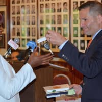 <p>Isla Brown receives her keys from Dutchess County County Executive Marc Molinaro.</p>