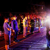 <p>Police and fire personnel using thermal-imaging equipment to search for any survivors of a car accident in Mahopac.</p>