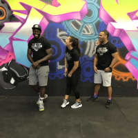 <p>Jessi Corredor, center, Tarrant Anderson, right and Michael Gee, left, the owners of The Fit Factory in Englewood.</p>