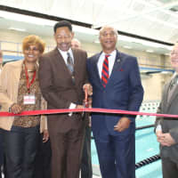 <p>Mount Vernon Schools Superintendent Kenneth Hamilton cutting the ribbon to the new pool with Assemblyman J. Gary Pretlow.</p>