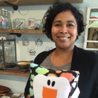 <p>Dawn-Marie Manwaring, a partner in Little Beehive store in New Rochelle with a tooth fairy pillow.</p>