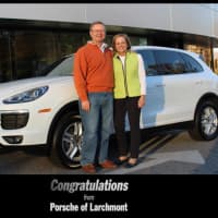<p>Ed and Diane Meyers shown with the Porsche Ed won at the tournament to benefit Presbyterian/Lawrence Hospital.</p>