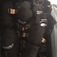 <p>Scarsdale realtor Anne Moretti brough solar hats to the Rwandan refugees so they can read in the dark.</p>