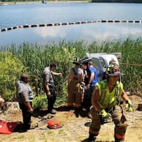<p>Police, fire, and EMTs work to save the occupants of a crash.</p>