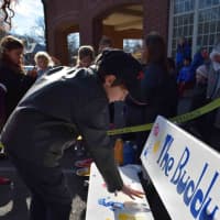 <p>Bronxville Elementary School students, who proposed the idea about the Buddy Bench to improve recess at their school, decorated the bench by leaving their handprints on it.</p>