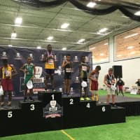 <p>Kyle Snow on the podium at the USA Track and Field Junior Olympics National Outdoor Championships.</p>