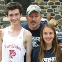 <p>John Collins (center), president Eastchester Irish American Social Club, congratulates winners of the Second Annual Eastchester 5K on Sept. 27, Marc Guberti (left), the overall winner, and Heather Joyce-Caliendo, the winning female runner.</p>