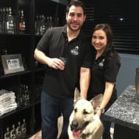 <p>Good Shepherd Owners Vinny and Carly Miata with their dog, Loki, for whom the distillery is named.</p>