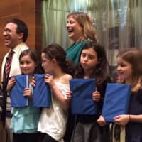 <p>The third grade class from Temple Beth El receiving their Siddur.</p>
