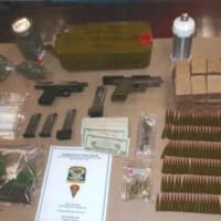 <p>Task force members seized drugs and guns during a raid of a Bridgeport home,</p>